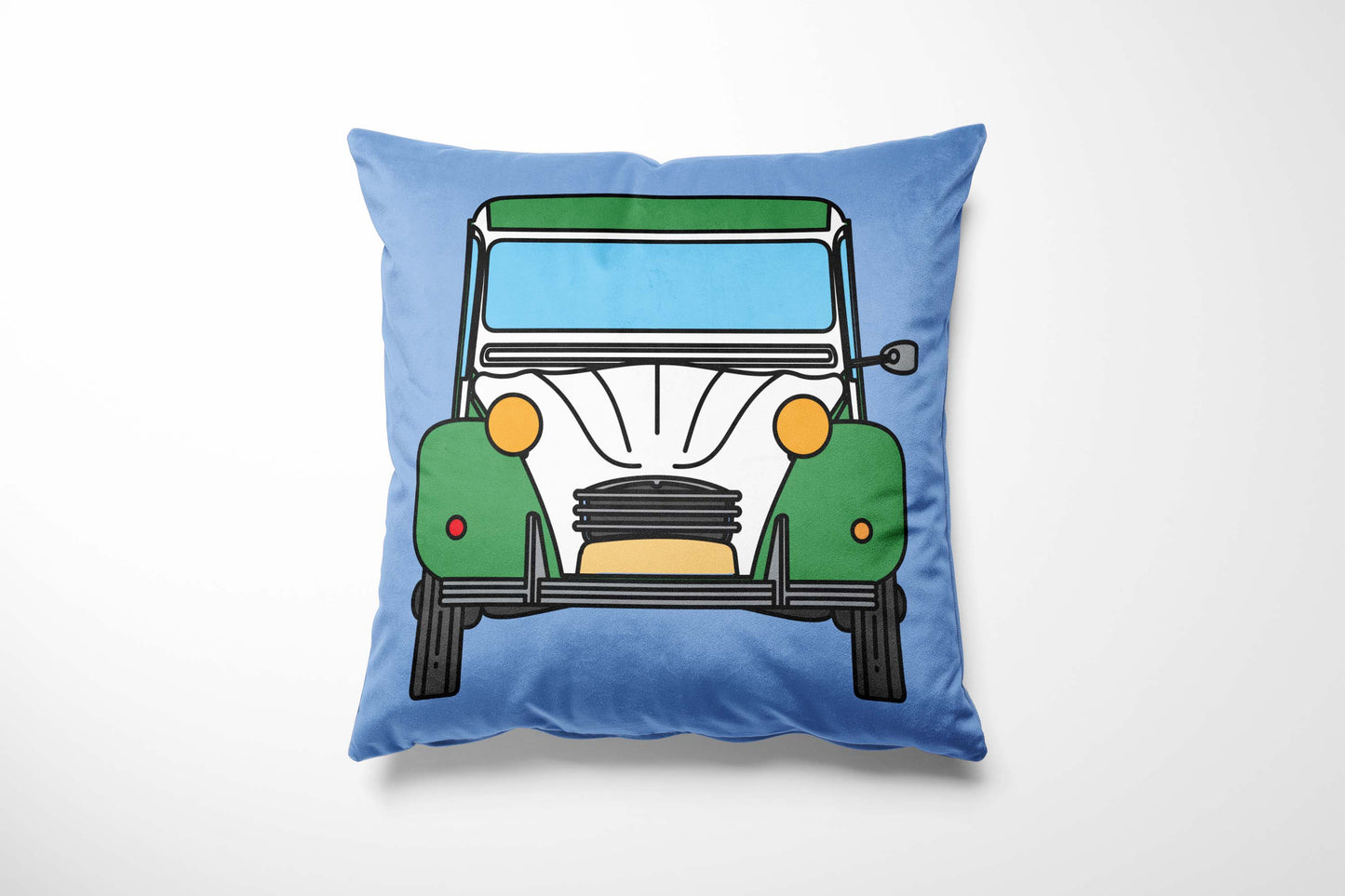 Cushion with a green & white car design on a light blue background
