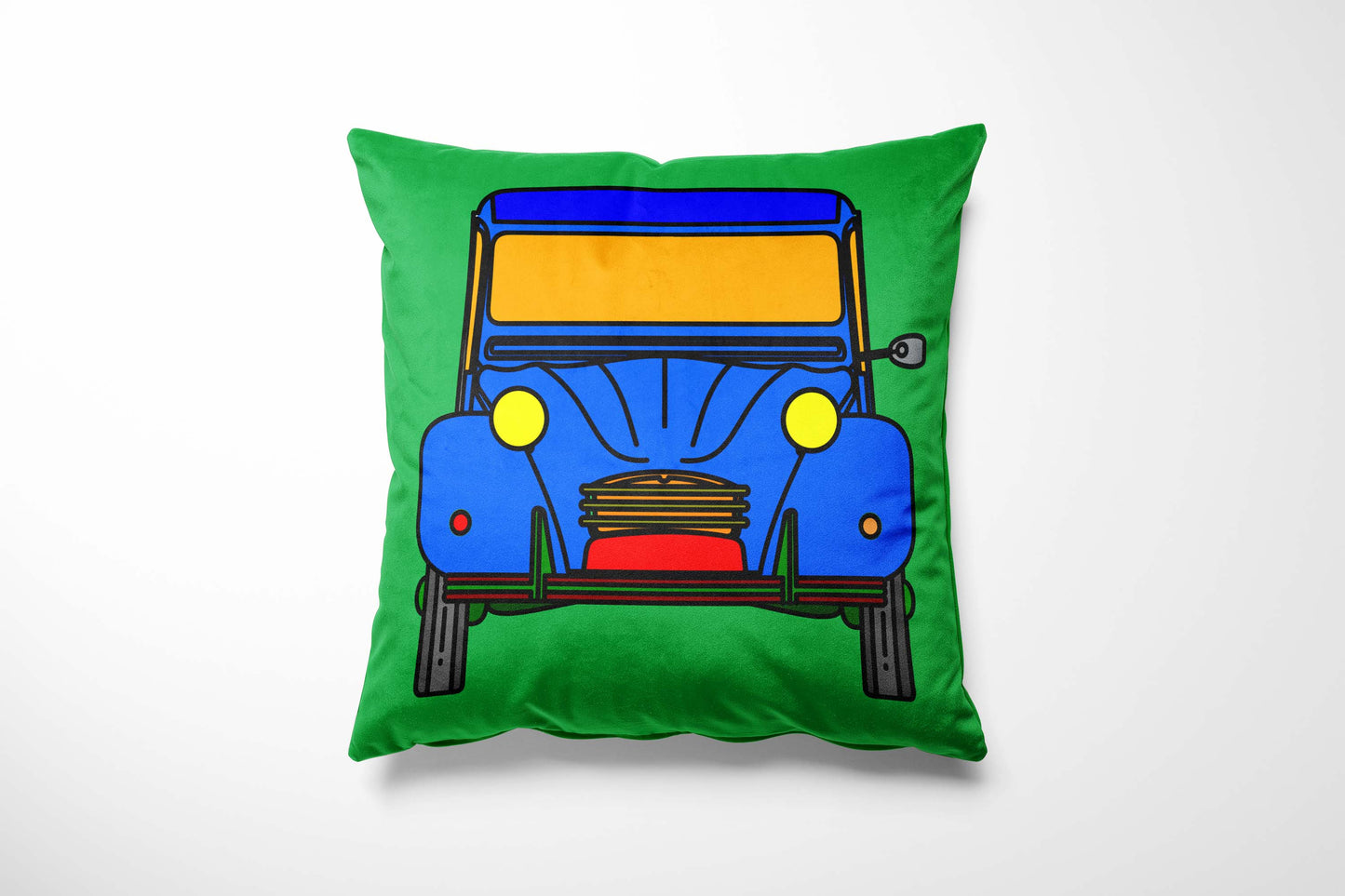 Cushion with a colourful car design on a green background