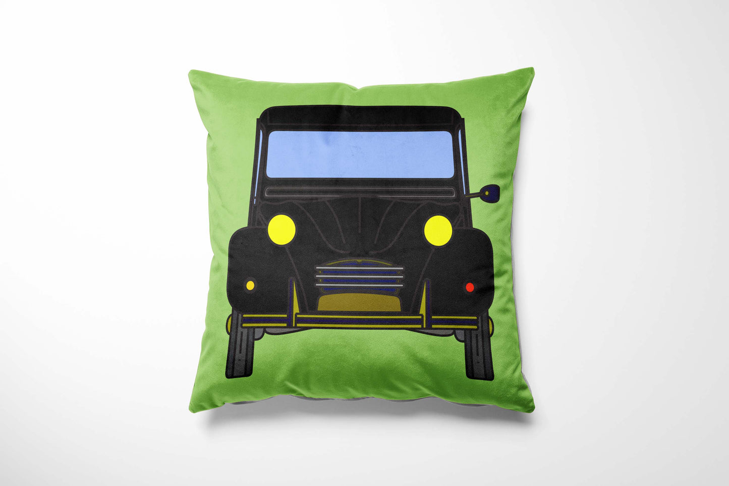 Green cushion with a black car design