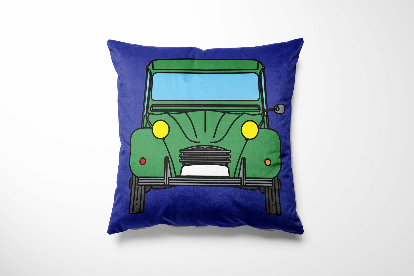 Cushion with a colourful green car design on a blue background