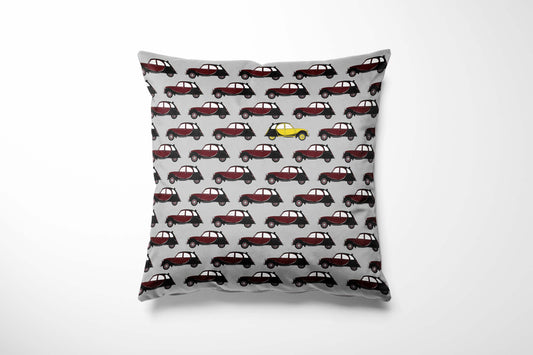 Cushion with maroon Charleston pattern on a grey background