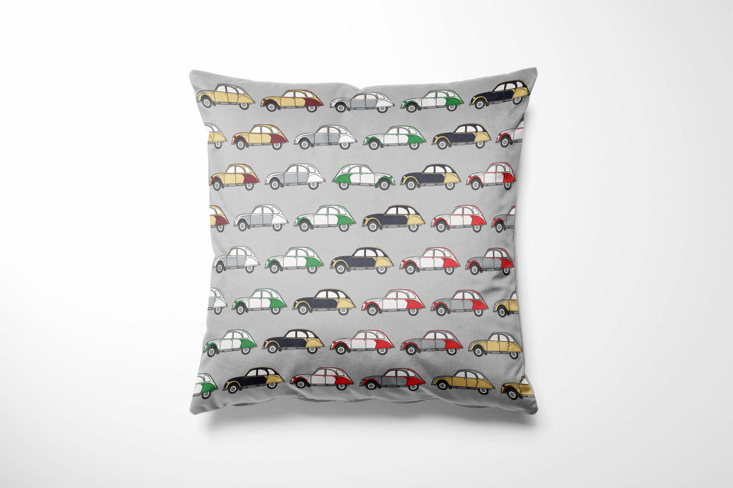 Cushion with a variety of 2CVs pattern on a grey background