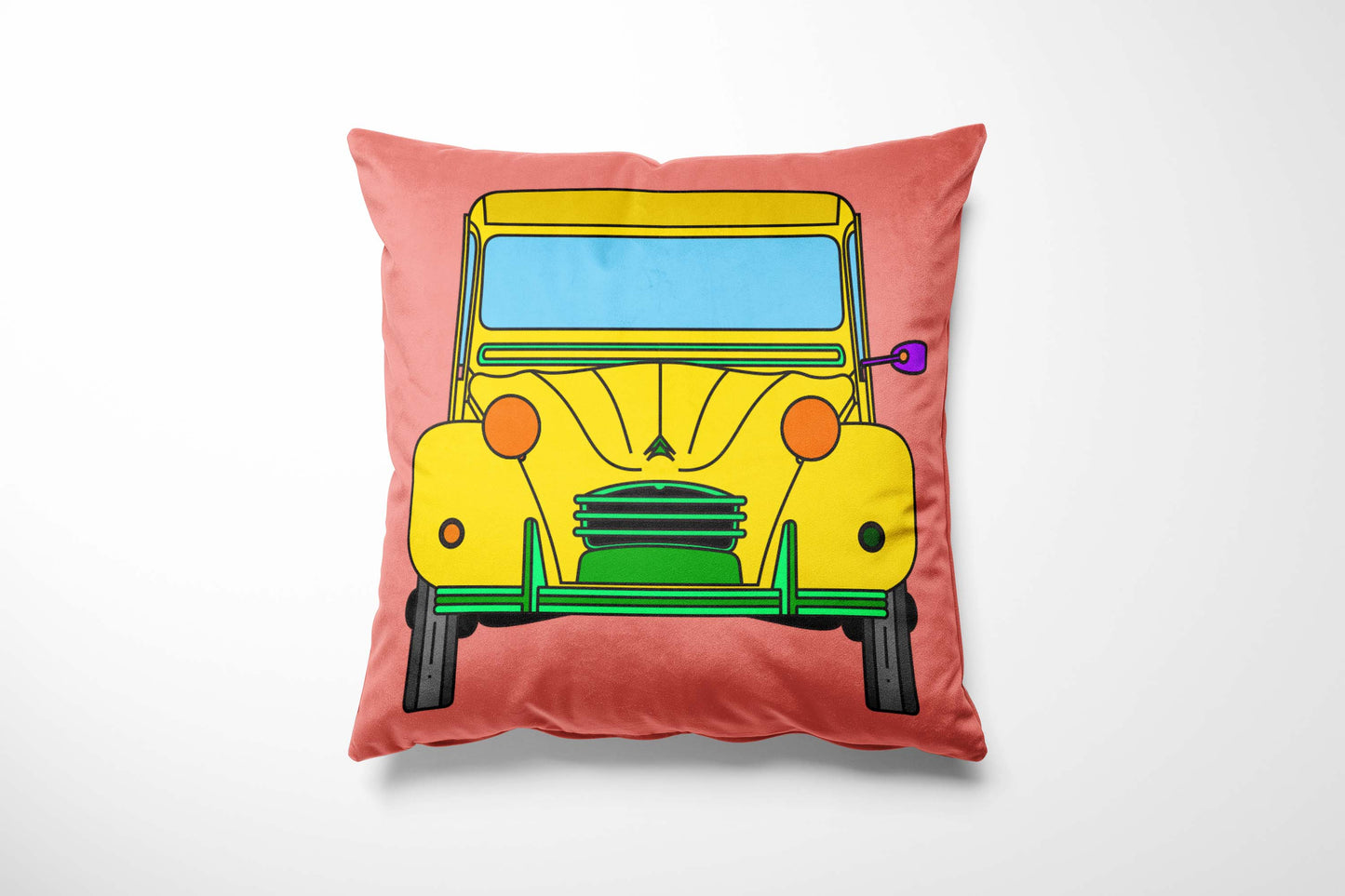 Cushion with a yellow car design on a pink background